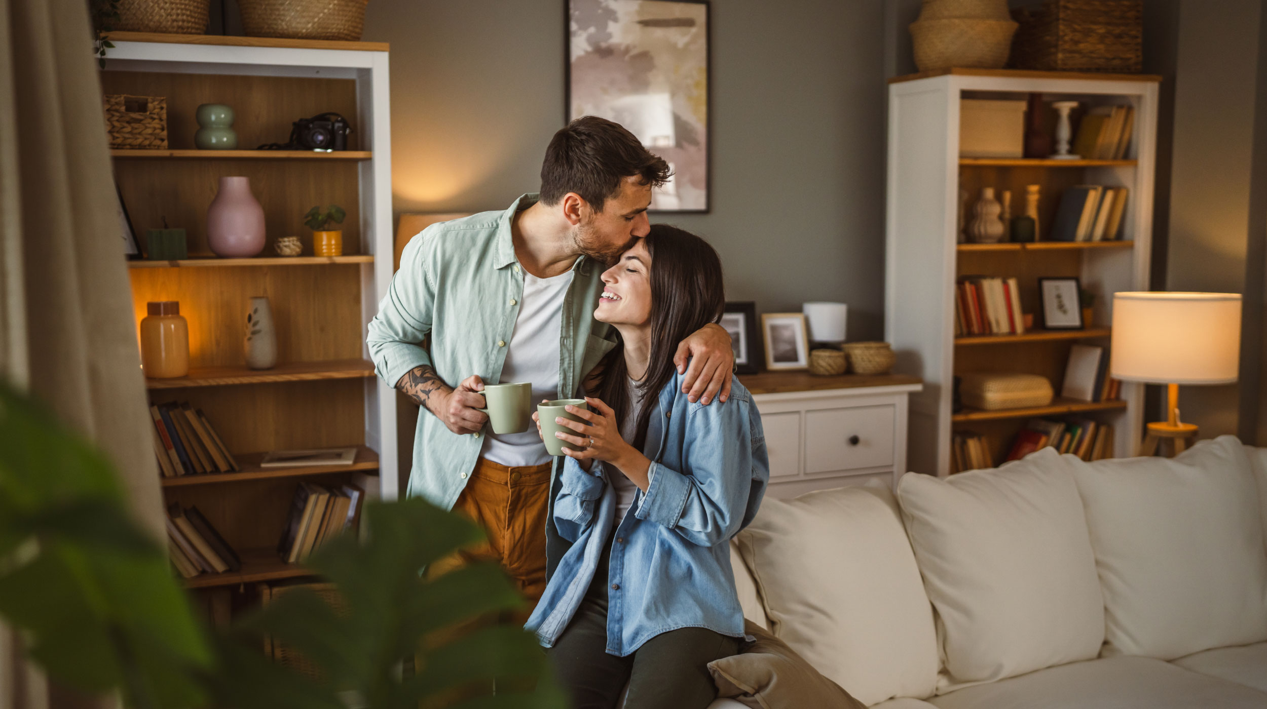 Happy couple drinking coffee in new southern California home